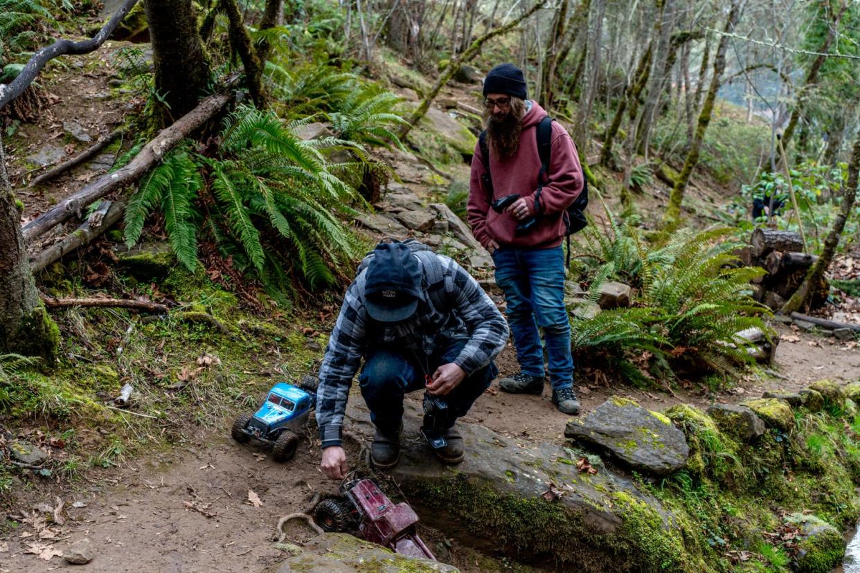 Jay Lemmons, right, and Mickey Kellum drive their radio-controlled vehicles at the Black Diamond RC Ranch in Sutherlin.