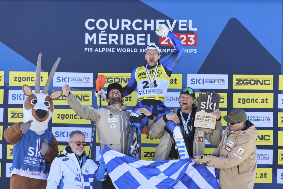 Greece's Aj Ginnis celebrates clinching the silver medal of the men's World Championship slalom, in Courchevel, France, Sunday Feb. 19, 2023. (AP Photo/Marco Trovati)