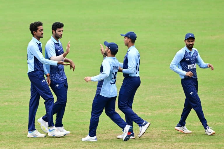 India celebrate after dismissing a Bangladesh batter at the Asian Games (Ishara S. KODIKARA)