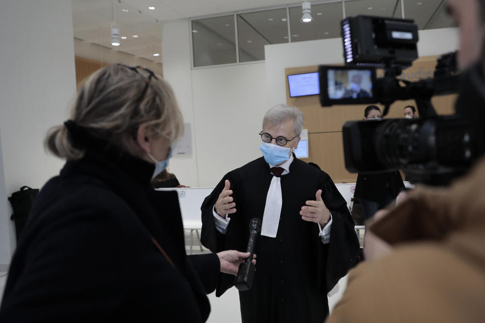 Plaintiffs lawyer Christophe Leguevaques answers reporters before the start of a hearing at the Paris palace of Justice, Wednesday, March 3, 2021. A Paris court holds a hearing Wednesday in a class-action effort to hold French health authorities and companies accountable after thousands of people with the virus died in nursing homes, and families were locked out and left in the dark about what was happening to their isolated loved ones. (AP Photo/Lewis Joly)