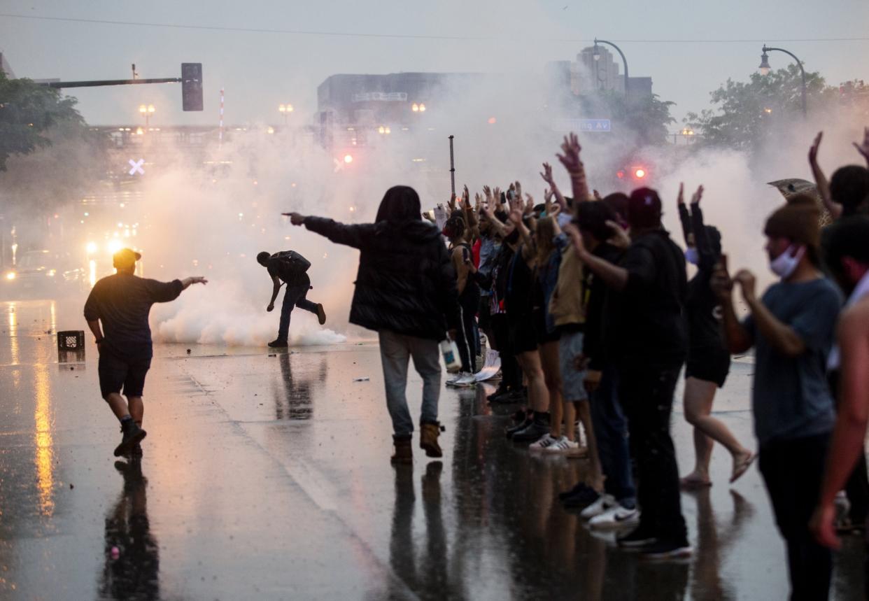 Protesters are met with tear gas outside Minneapolis's 3rd Police Precinct: Getty Images