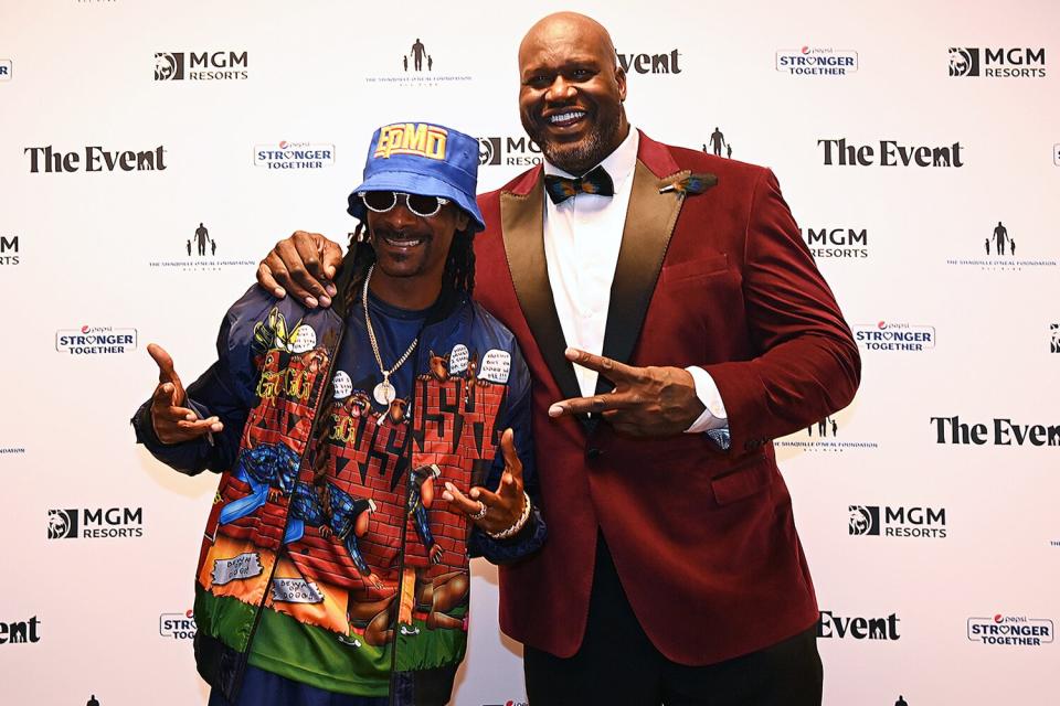 Snoop Dogg and former professional basketball player Shaquille O'Neal pose for a photo at the Shaquille O'Neal Foundation event at the MGM Grand Garden Arena on October 2, 2021 in Las Vegas, Nevada.