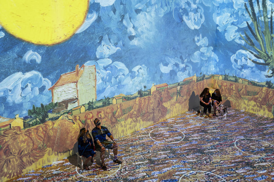 Projections of selected works of celebrated painter Vincent Van Gogh are displayed at a preview of the Immersive Van Gogh exhibit at Pier 36, Friday, June 4, 2021, in New York. (AP Photo/John Minchillo)