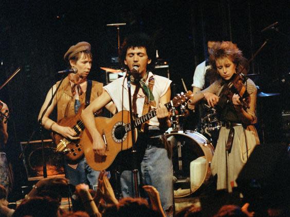 John ‘Rhino’ Edwards, Kevin Rowland and Helen O’Hara of Dexys Midnight Runners performing in 1983 (Rex Features)