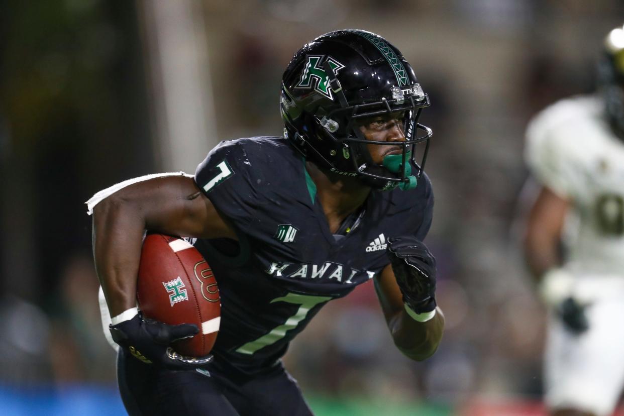 Hawaii running back Calvin Turner Jr. (7) of Savannah runs the ball during a game against Colorado State on Nov. 20, 2021, in Honolulu.