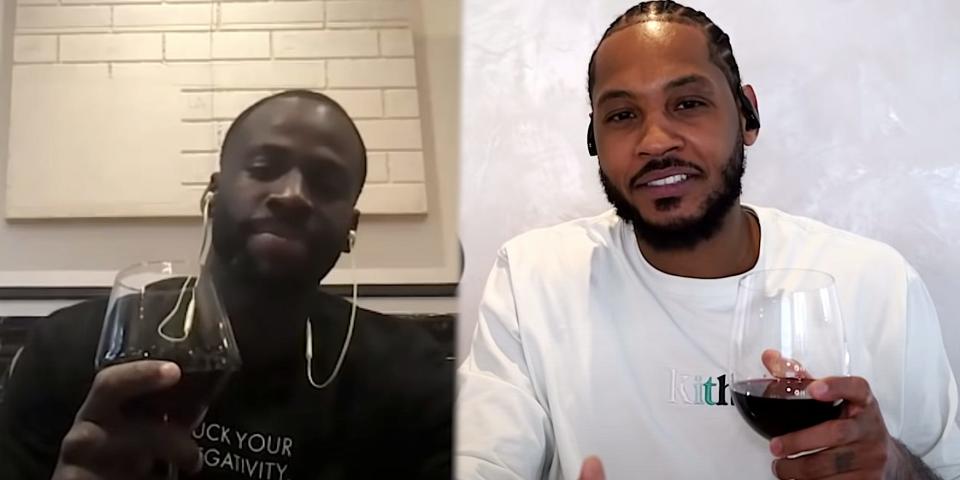 A screenshot of a podcast featuring Carmelo Anthony and Draymond Green shows the two players holding up glasses of red wine while speaking.