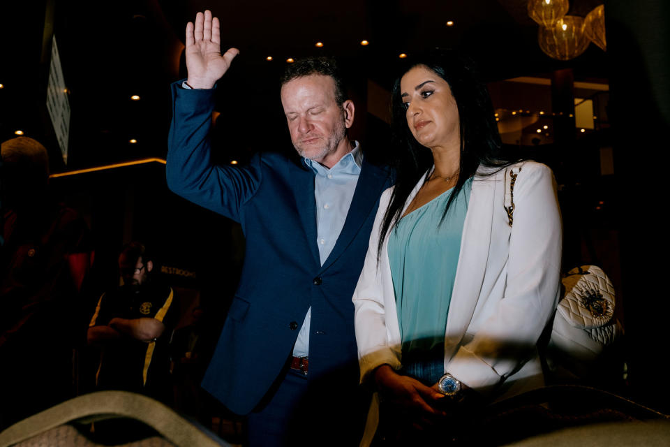 Attendees participate in the invocation. (Mark Abramson for NBC News)