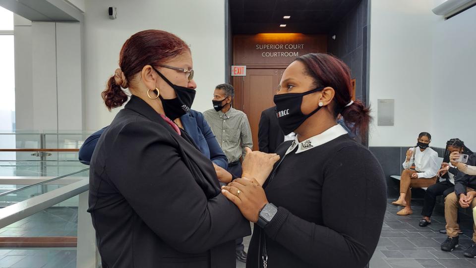 File photo: Jaime Resende's mother Maria (Bethe) Fernandes and cousing Lizangela Teixeira speak outside the courtroom prior to a bail hearing in his case on Sept. 22, 2021.