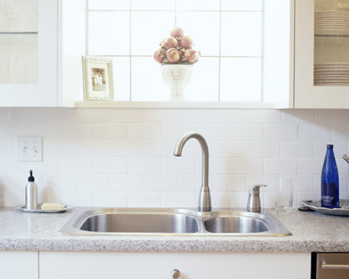 Combine dark grey grout with white subway tiles so they take on a vintage vibe or stick with brilliant white as pictured. As for practicality near washing and cooking zones, they’re nothing less than perfect.