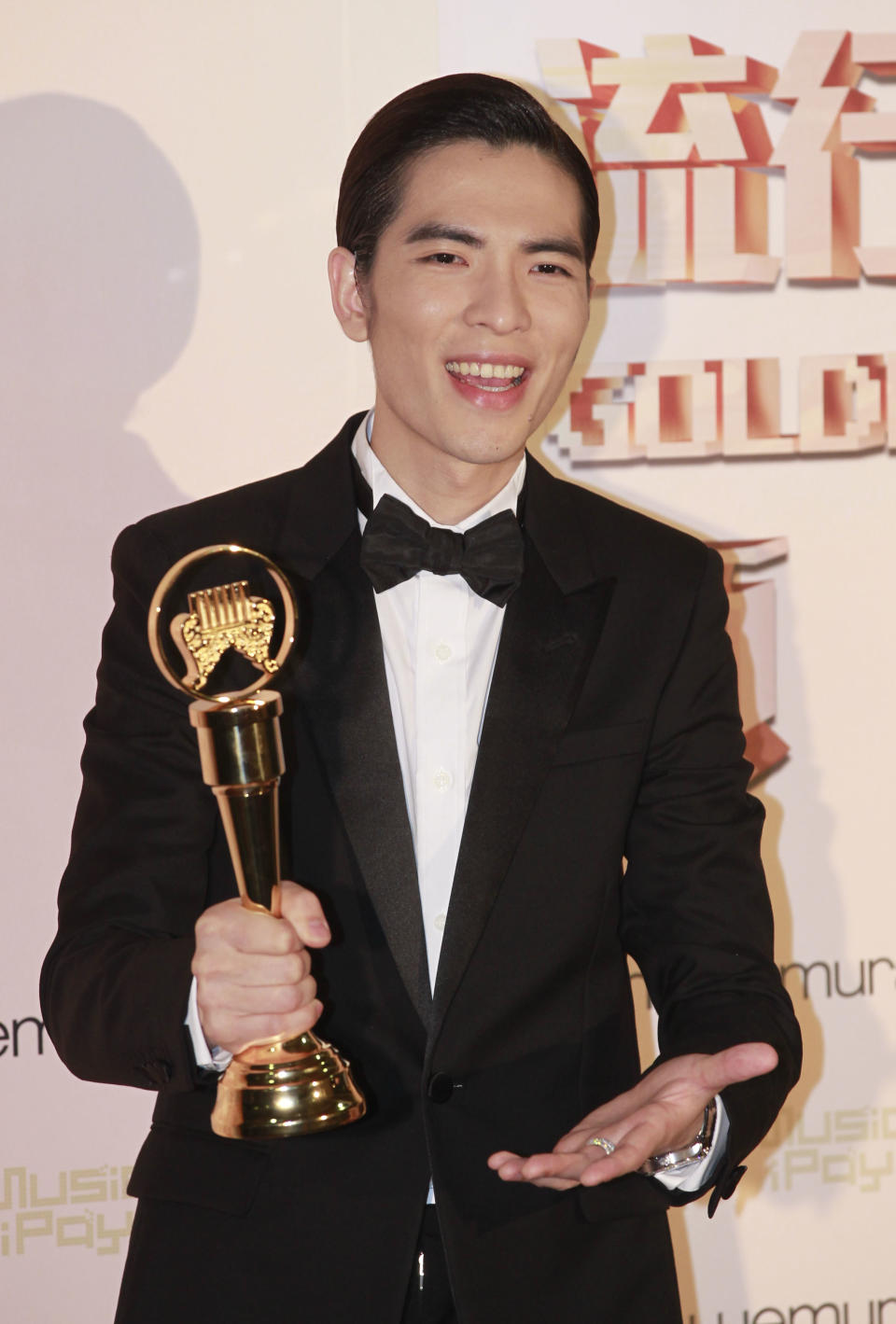 Taiwanese singer Jam Hsiao holds his award for Best Male Vocal Performer at the 24th Golden Melody Awards in Taipei, Taiwan, Saturday, July 6, 2013. The Golden Melody Awards is one of the Chinese-language pop music world's biggest annual events.(AP Photo/Wally Santana)