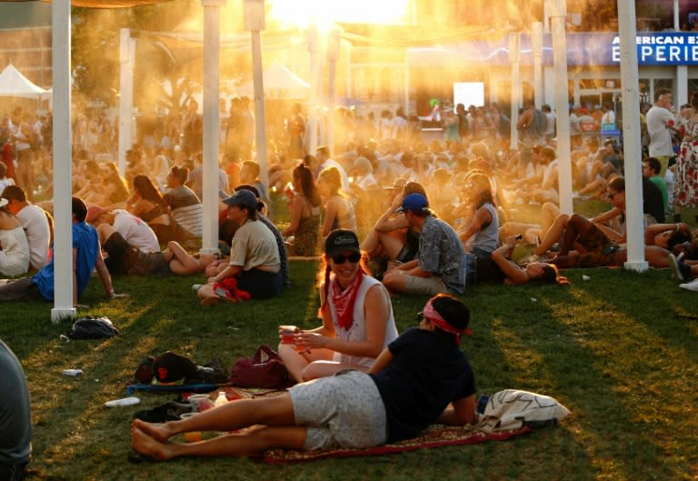 Revelers cool off on the second day of the Panorama Music Festival on July 23, 2016