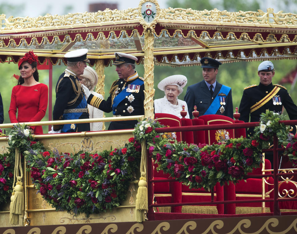 Members of the British royal family (L-R) Catherine, Duchess of Cambridge, Prince Philip, Duke of Edinburgh, Prince Charles, Prince of Wales, Britain's Queen Elizabeth II, Prince Harry and Prince William stand aboard the royal barge 'Spirit of Chartwell' during the Thames Diamond Jubilee Pageant on the River Thames in London on June 3, 2012. Queen Elizabeth II was to sail on a ceremonial barge down the Thames on Sunday at the centre of a 1,000-boat pageant to mark her diamond jubilee, although heavy rain threatened to spoil the party. AFP PHOTO / POOL / PAUL GROVER        (Photo credit should read PAUL GROVER/AFP/GettyImages)