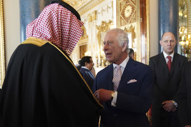 Britain's King Charles III speaks to guests during a reception at Buckingham Palace in London Friday May 5, 2023, for a reception hosted by Britain's King Charles III, for overseas guests attending his coronation. (Jacob King, Pool via AP)