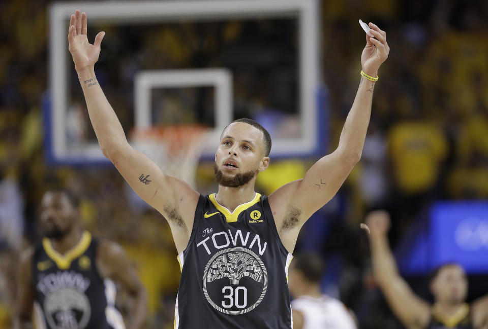 Steph Curry celebrates a 3-pointer in the second half of Game 2 Sunday night. (Getty)