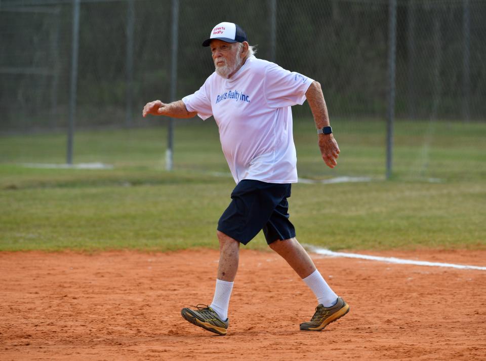 Dave Wulfsohn, 90, runs to second base on a base hit during a game at Sarasota Senior Softball Thursday at 17th Street Park. Wulfsohn usually has a pinch runner in for him, but Thursday, none of his teammates were able to step in as pinch runners, so he took care of the base running himself.