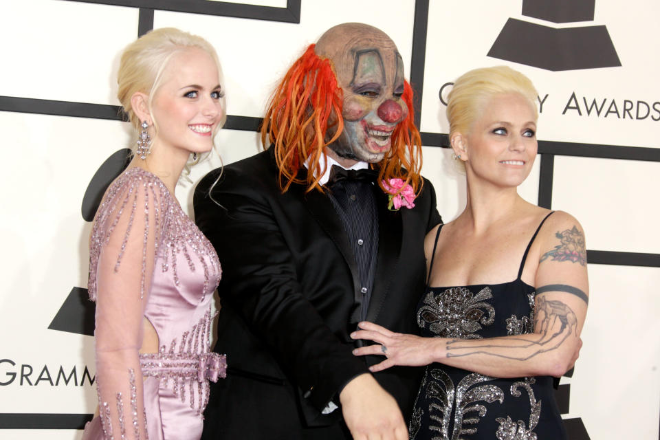 Gabrielle Crahan (left) pictured with her Slipknot drummer father, Shawn Crahan and mother, Chantel.