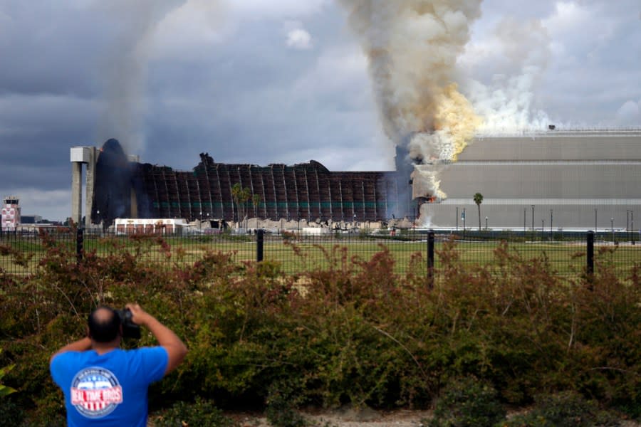 A historic blimp hangar burns in Tustin, Calif., Tuesday, Nov. 7, 2023. A fire destroyed a massive World War II-era wooden hangar that was built to house military blimps based in Southern California. (AP Photo/Jae C. Hong)