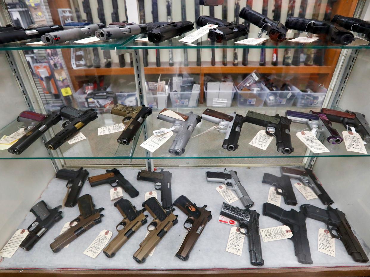 In this March 25, 2020, file photo semi-automatic handguns are displayed at shop in New Castle, PA.  (AP)