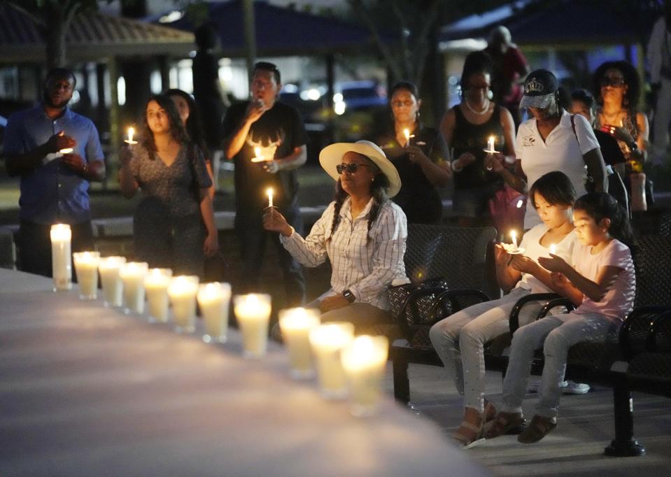 People gather at a remembrance for Buffalo shooting victims at Eastlake Park in Phoenix on May 18, 2022.