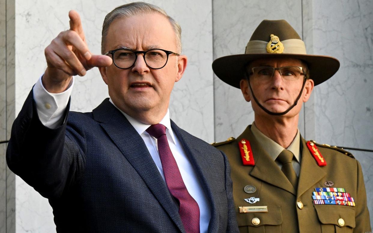 Anthony Albanese, the Australian prime minister, and General Angus Campbell, the chief of the Australian Defence Force, speak after the release of the Defence Strategic Review - Reuters