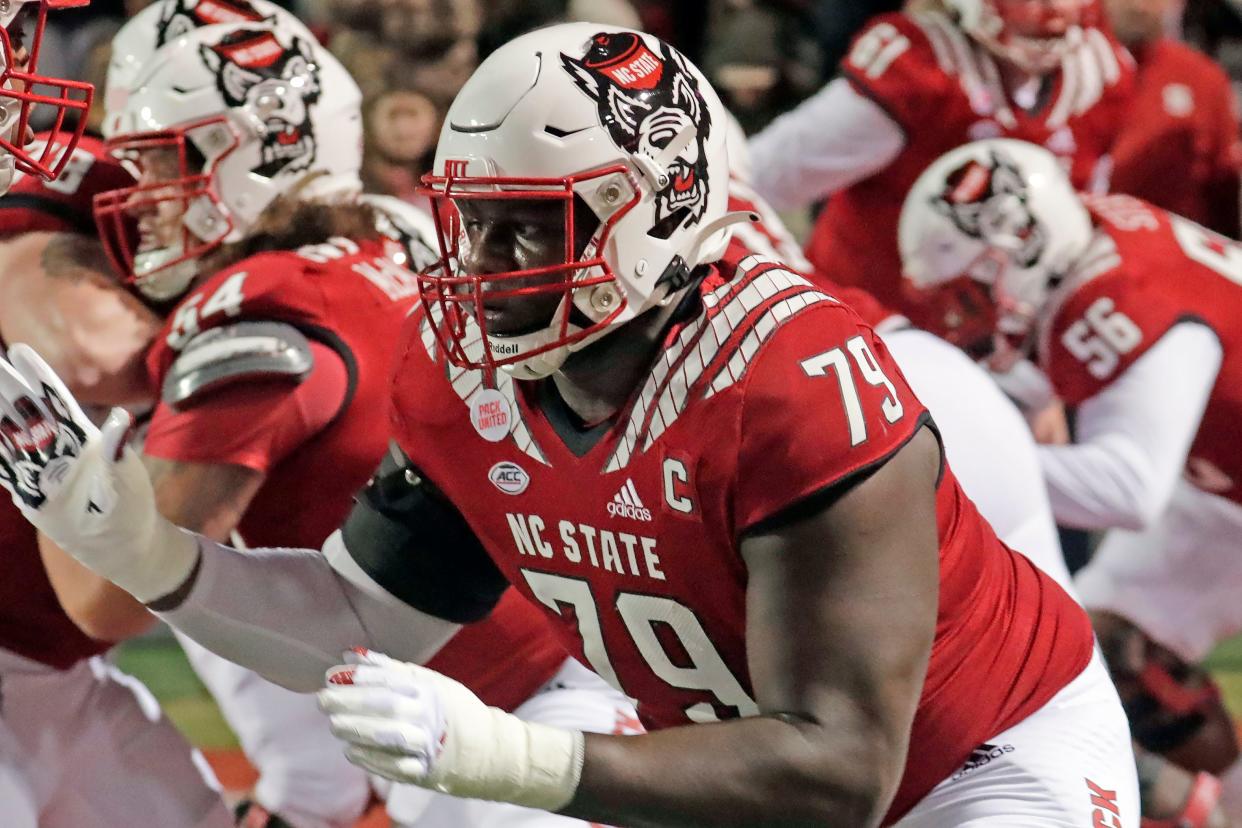 North Carolina State offensive tackle Ikem Ekwonu (79) warms up before an NCAA college football game against North Carolina Friday, Nov. 26, 2021, in Raleigh, N.C.