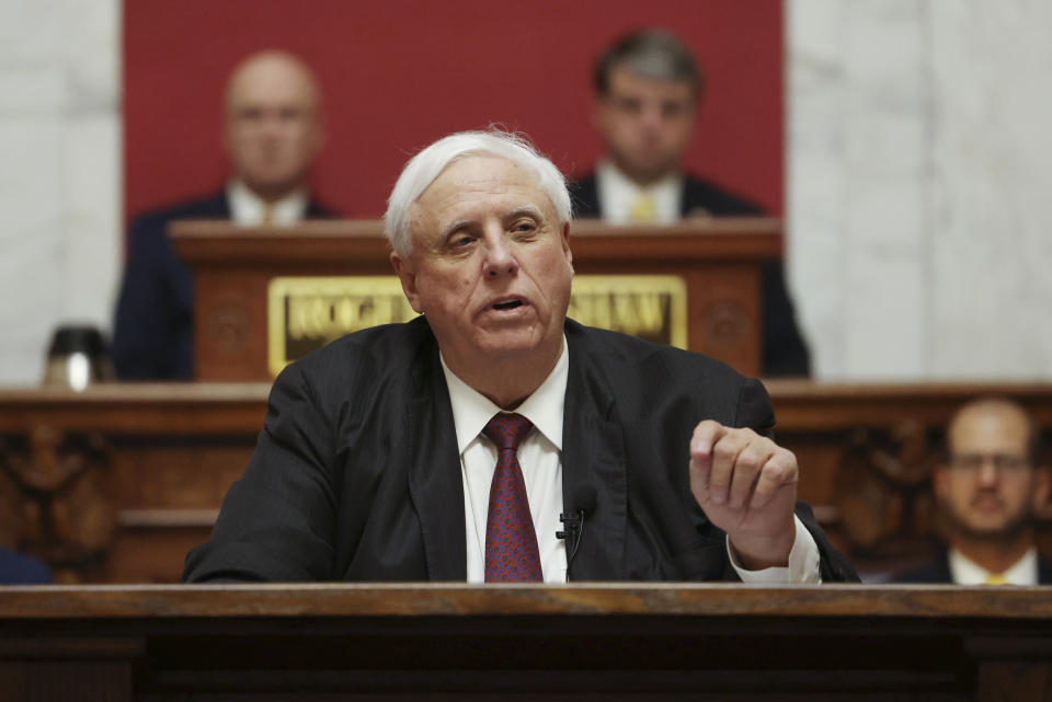FILE - West Virginia Gov. Jim Justice delivers his annual State of the State address in the House Chambers of the state Capitol, Jan. 11, 2023, in Charleston, W.Va. When West Virginia Republican primary voters head to the polls Tuesday, May 14, 2024, they'll have a hard time finding a major candidate on the ballot in any statewide race who openly acknowledges U.S. President Joe Biden as the winner of the 2020 election. (AP Photo/Chris Jackson, File)