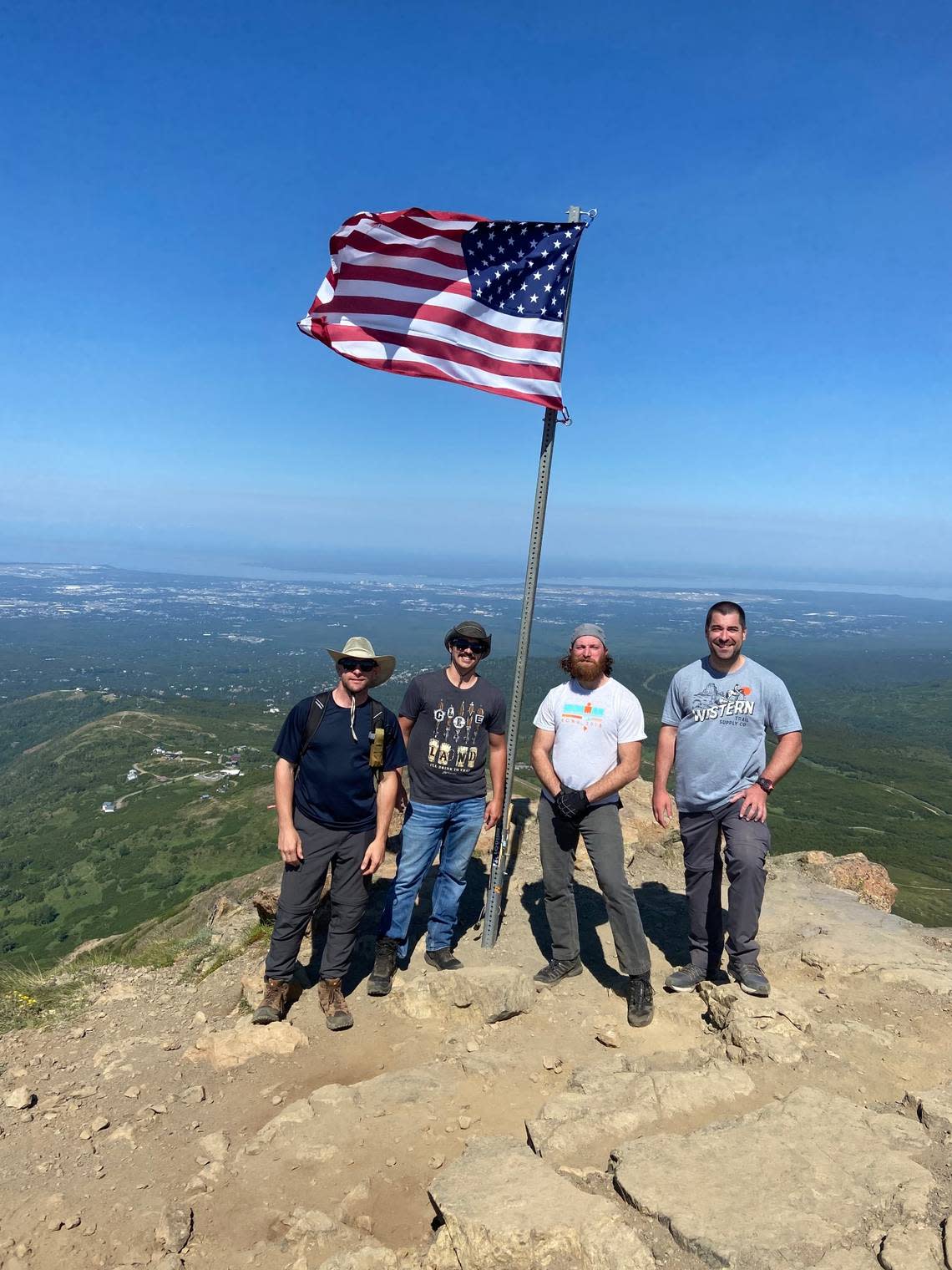 Rollin Pachinger, Jason Sorgen, Gabriel Ananea, and Bryan Brown from Mentor, Ohio, hiking in Alaska.