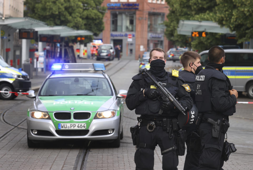 Police cars attend the scene of an incident in Wuerzburg, Germany, Friday June 25, 2021. German police say several people have been killed and others injured in a knife attack in the southern city of Wuerzburg on Friday. (Karl-Josef Hildenbrand/dpa via AP)