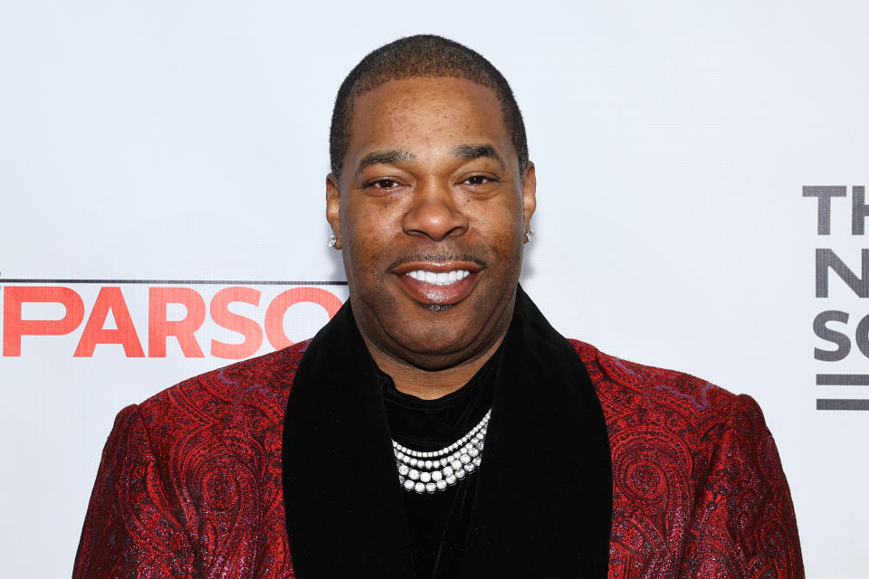 Busta Rhymes Wearing Red Suit
