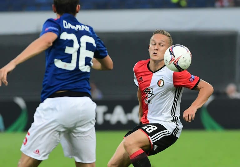 Feyenoord's Jens Toornstra (R) controls the ball next to Manchester United's Italian defender Matteo Darmian during the UEFA Europa League football match between Feyenoord Rotterdam and Manchester United