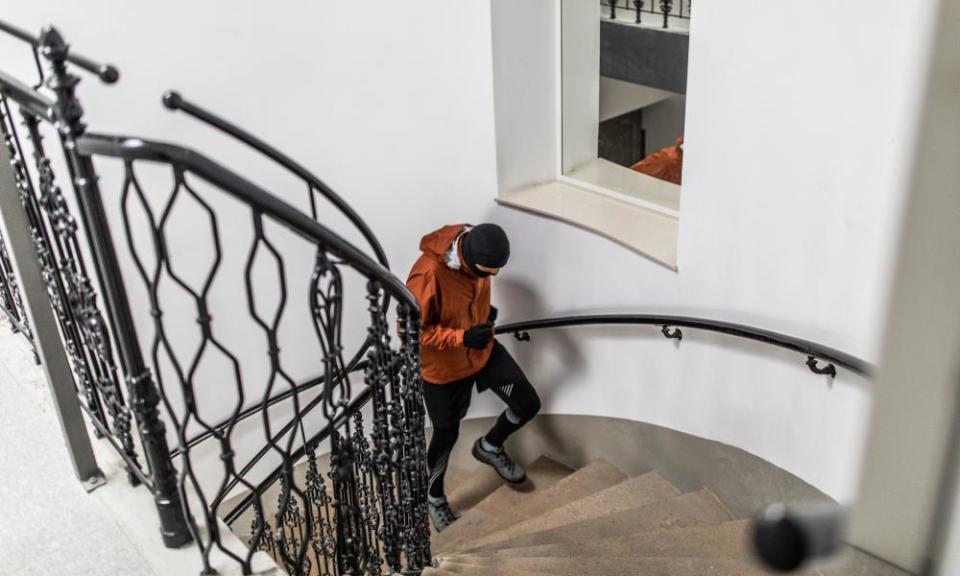 Young male athlete running up the stairs