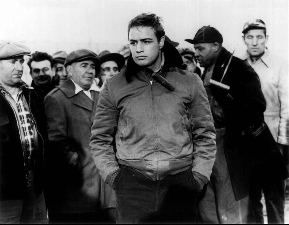 Marlon Brando (center) stars as boxer-turned-longshoreman Terry Malloy in "On the Waterfront."