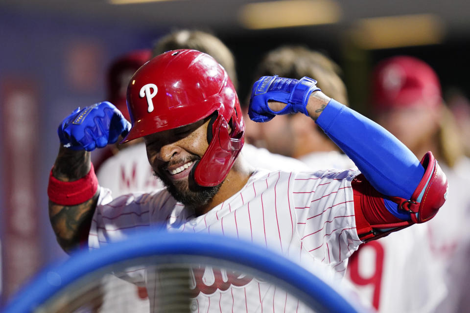 Philadelphia Phillies' Edmundo Sosa celebrates in dugout after hitting a two-run home run against Miami Marlins pitcher Trevor Rogers during the third inning of a baseball game, Wednesday, Sept. 7, 2022, in Philadelphia. (AP Photo/Matt Slocum)