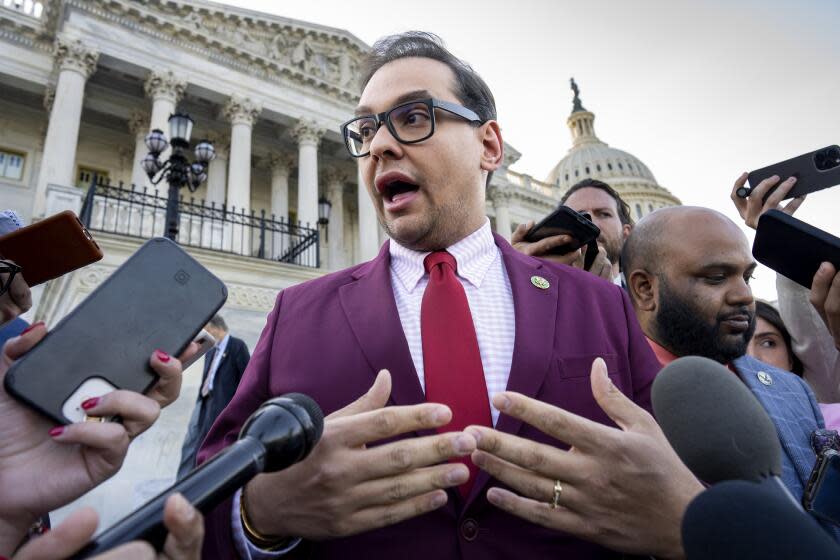 FILE - Rep. George Santos, R-N.Y., speaks to reporters outside after an effort to expel him from the House, at the Capitol in Washington, May 17, 2023. (AP Photo/J. Scott Applewhite, File)