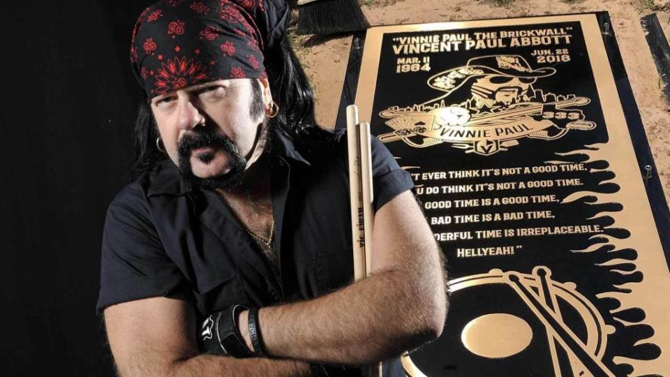 <p>Pantera drummer, Vinnie Paul, will be rocking out in heaven next to his brother and now his tombstone is just as loud as his music. Pantera revealed the grave marker for Paul, which was laid at Moore Memorial Gardens this week in Arlington, TX. Along with a detailed depiction of the rocker wearing his trademark […]</p> <p>The post <a rel="nofollow noopener" href="https://theblast.com/pantera-vinnie-paul-gravemarker-brother-dimebag-darrell/" target="_blank" data-ylk="slk:Pantera’s Vinnie Paul Gets Ornate Grave Marker Next to Brother, Dimebag Darrell;elm:context_link;itc:0;sec:content-canvas" class="link ">Pantera’s Vinnie Paul Gets Ornate Grave Marker Next to Brother, Dimebag Darrell</a> appeared first on <a rel="nofollow noopener" href="https://theblast.com" target="_blank" data-ylk="slk:The Blast;elm:context_link;itc:0;sec:content-canvas" class="link ">The Blast</a>.</p>