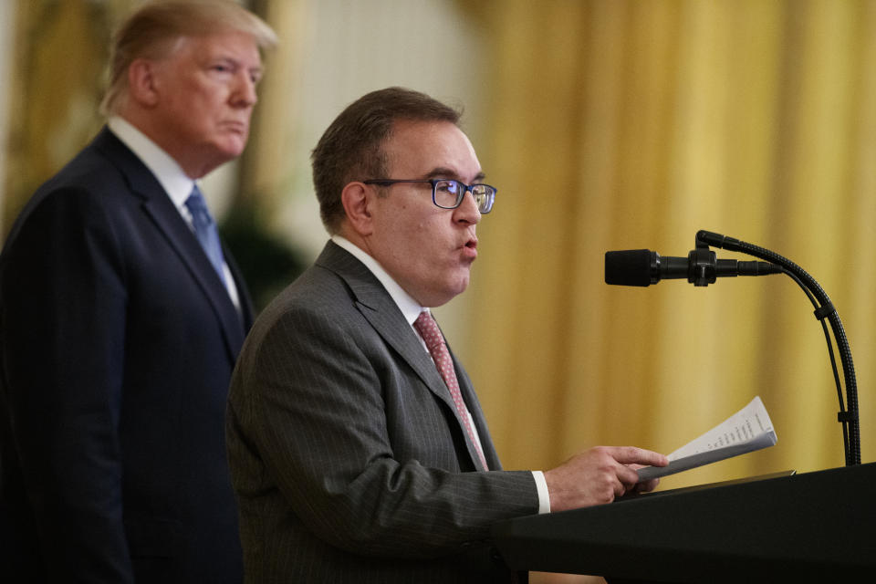 In this July 8, 2019, photo, President Donald Trump listens as Environmental Protection Agency Administrator Andrew Wheeler speaks during an event on the environment in the East Room of the White House in Washington. (AP Photo/Evan Vucci)