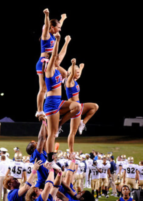 Cheerleaders and football players.