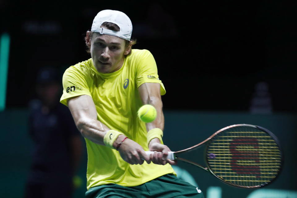 Australia's Alex de Minaur returns the ball to Canada's Felix Auger Aliassime during the final Davis Cup tennis match between Australia and Canada in Malaga, Spain, Sunday, Nov. 27, 2022. (AP Photo/Joan Monfort)