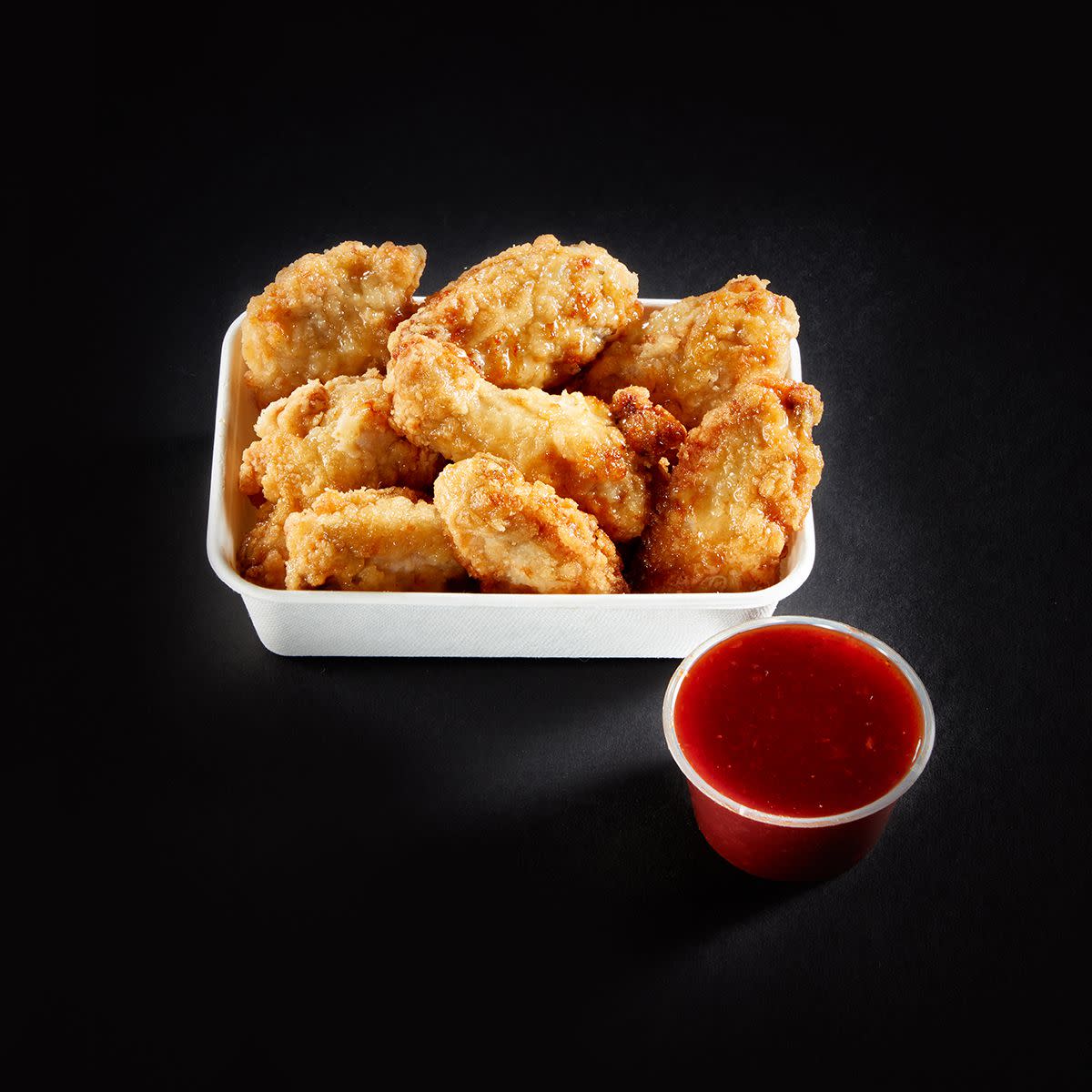 Chicken wings with Korean fried chicken sauce at Costco food court.