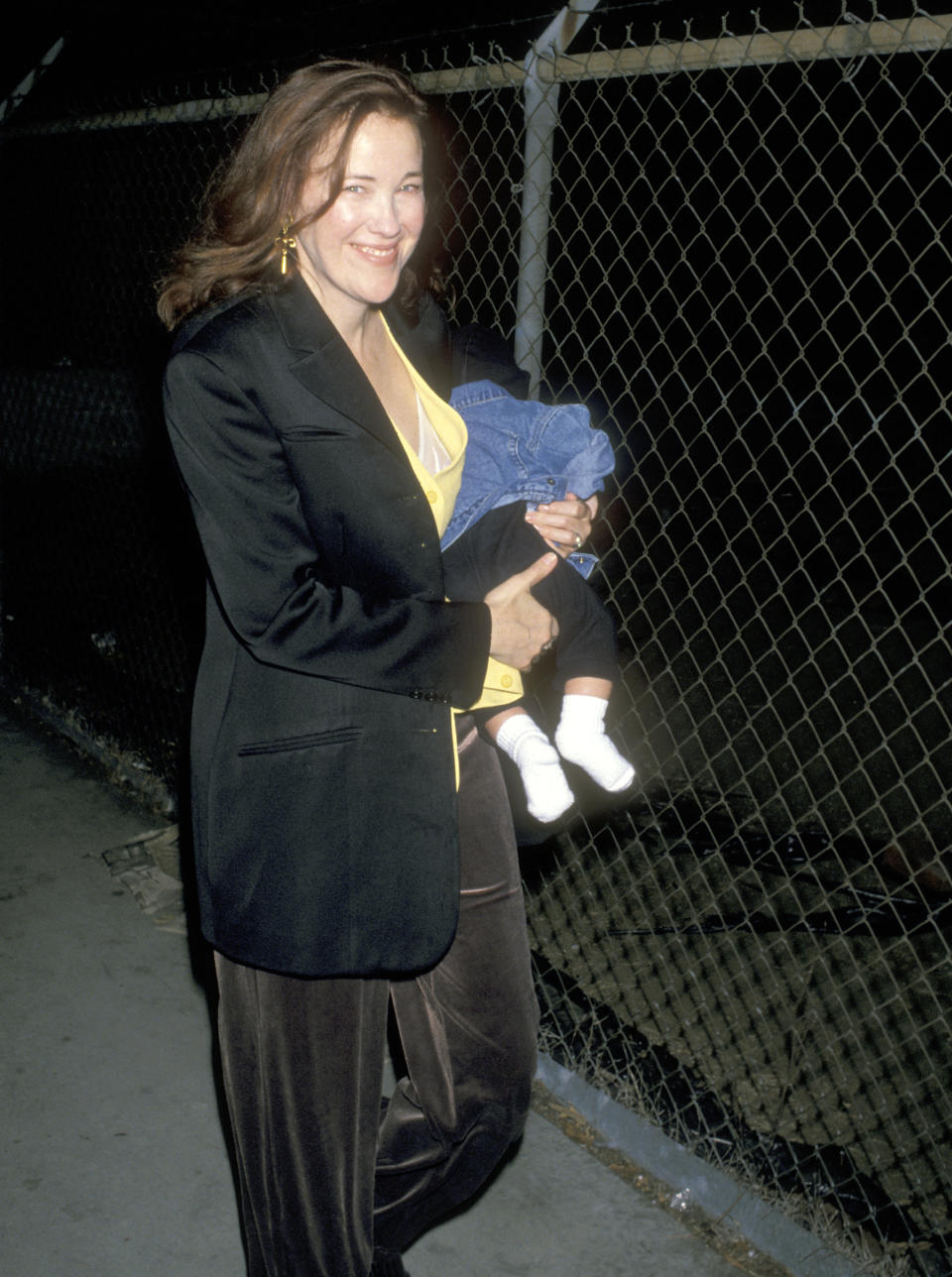 Catherine O'Hara holding a baby