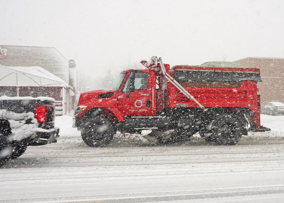 An Adrian Department of Public Works snowplow is seen in action Wednesday afternoon, Jan. 25, 2023, plowing a stretch of South Main Street near Beecher Street.