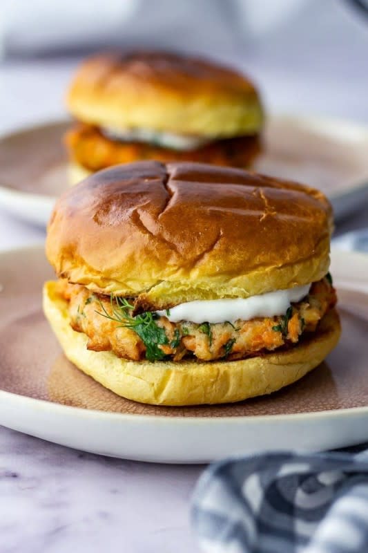 <p>The Cook Report</p><p>These salmon burgers are so quick to make! Use canned or leftover salmon and you'll have this amazing dinner on the table in 15 minutes.</p><p><strong>Get the recipe: <a href="https://thecookreport.co.uk/15-minute-salmon-burgers-garlic-yoghurt/" rel="nofollow noopener" target="_blank" data-ylk="slk:15-Minute Salmon Burgers with Garlic Yogurt;elm:context_link;itc:0;sec:content-canvas" class="link ">15-Minute Salmon Burgers with Garlic Yogurt</a></strong></p>
