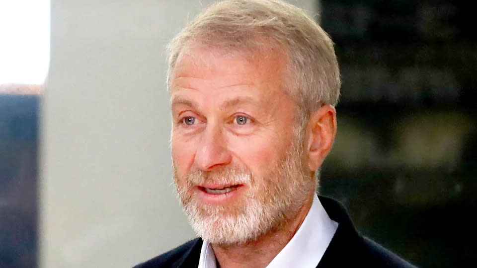 Chelsea's billionaire owner Roman Abramovich is pictured smiling in this photo.