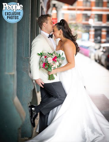 <p>Alfonso Lozano</p> Ciara Schirripa and Zach Binder embrace on their wedding day.
