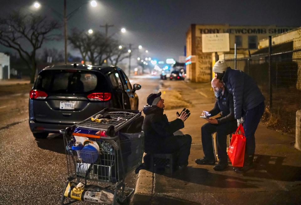 Trace Karpe and Jennifer Goodrich interview a homeless man early Thursday in northwest Oklahoma City during the Point-In-Time survey.