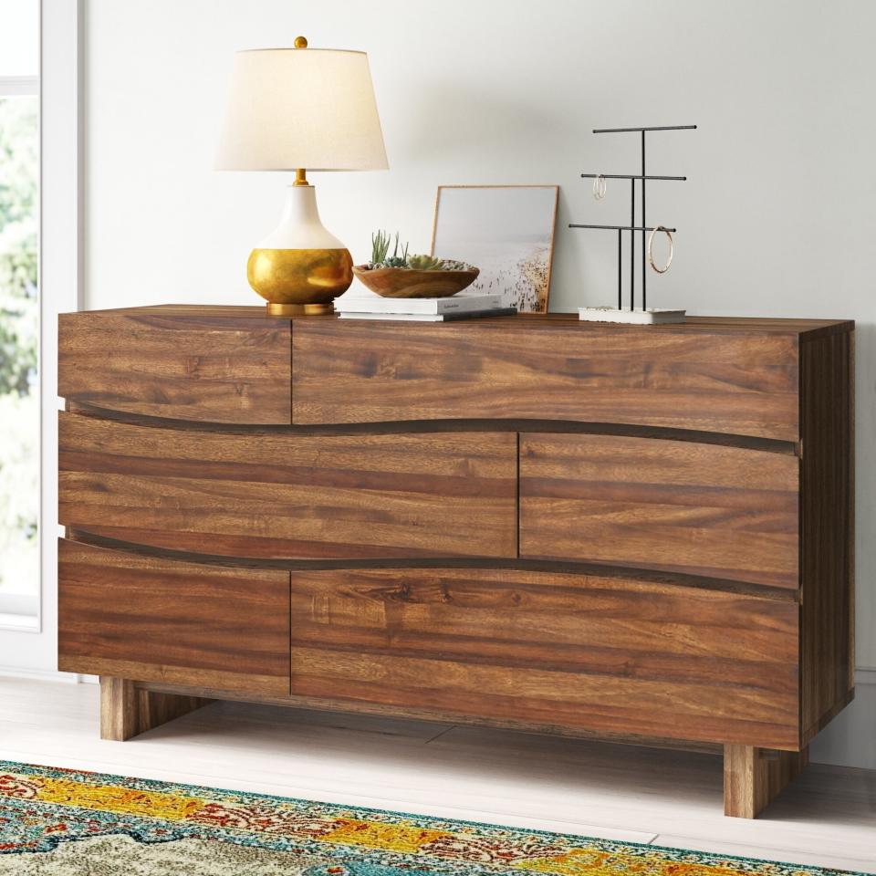 It has six drawers that'll easily fit lingerie, shirts, jeans and all those athleisure sets you've bought in the last year. Plus, you can use the top for lamps, mirrors and jewelry stands. <br /><br /><strong>Promising review:</strong> "Love it! It is a beautiful dresser and looks even better in person." &mdash; <a href="https://go.skimresources.com?id=38395X987171&amp;xs=1&amp;xcust=-HPWayDaySale4-28-21-60896f93e4b09cce6c197126&amp;url=https%3A%2F%2Fwww.wayfair.com%2Ffurniture%2Fpdp%2Fmistana-hiram-6-drawer-dresser-w000917326.html" target="_blank" rel="noopener noreferrer">Kaitlen</a><br /><br /><strong>Price:</strong> <a href="https://go.skimresources.com?id=38395X987171&amp;xs=1&amp;xcust=-HPWayDaySale4-28-21-60896f93e4b09cce6c197126&amp;url=https%3A%2F%2Fwww.wayfair.com%2Ffurniture%2Fpdp%2Fmistana-hiram-6-drawer-dresser-w000917326.html" target="_blank" rel="nofollow noopener noreferrer" data-skimlinks-tracking="5937619" data-vars-affiliate="www.tkqlhce.com" data-vars-campaign="BestFurnitureDealsWayfair-Keaveney-4-26-21-5937619" data-vars-href="https://www.tkqlhce.com/click-8209452-13720150?sid=BestFurnitureDealsWayfair-Keaveney-4-26-21-5937619&amp;url=https%3A%2F%2Fwww.wayfair.com%2Ffurniture%2Fpdp%2Fmistana-hiram-6-drawer-dresser-w000917326.html" data-vars-link-id="16666923" data-vars-price="" data-vars-product-id="21098810" data-vars-product-img="https://secure.img1-fg.wfcdn.com/im/57601808/resize-h800-w800%5Ecompr-r85/1220/122003317/Hiram+6+Drawer+Dresser.jpg" data-vars-product-title="Hiram 6 Drawer Dresser" data-vars-redirecturl="https://www.wayfair.com/furniture/pdp/mistana-hiram-6-drawer-dresser-w000917326.html" data-vars-retailers="wayfair" data-ml-dynamic="true" data-ml-dynamic-type="sl" data-orig-url="https://www.tkqlhce.com/click-8209452-13720150?sid=BestFurnitureDealsWayfair-Keaveney-4-26-21-5937619&amp;url=https%3A%2F%2Fwww.wayfair.com%2Ffurniture%2Fpdp%2Fmistana-hiram-6-drawer-dresser-w000917326.html" data-ml-id="30">$819.99</a> (originally $2,200)<br /><br /><i>See more bedroom furniture on sale <a href="https://go.skimresources.com?id=38395X987171&amp;xs=1&amp;xcust=-HPWayDaySale4-28-21-60896f93e4b09cce6c197126&amp;url=https%3A%2F%2Fwww.wayfair.com%2Fdaily-sales%2Fway-day%253a-bedroom-furniture%7Ee220826.html" target="_blank" rel="noopener noreferrer">starting at $90</a>. </i>