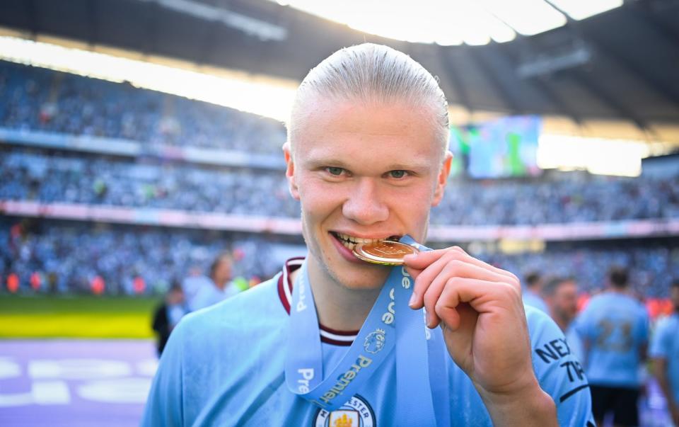 Haaland with his Premier League winner's medal - Erling Haaland’s Man City goals and the records broken - Michael Regan/Getty Images
