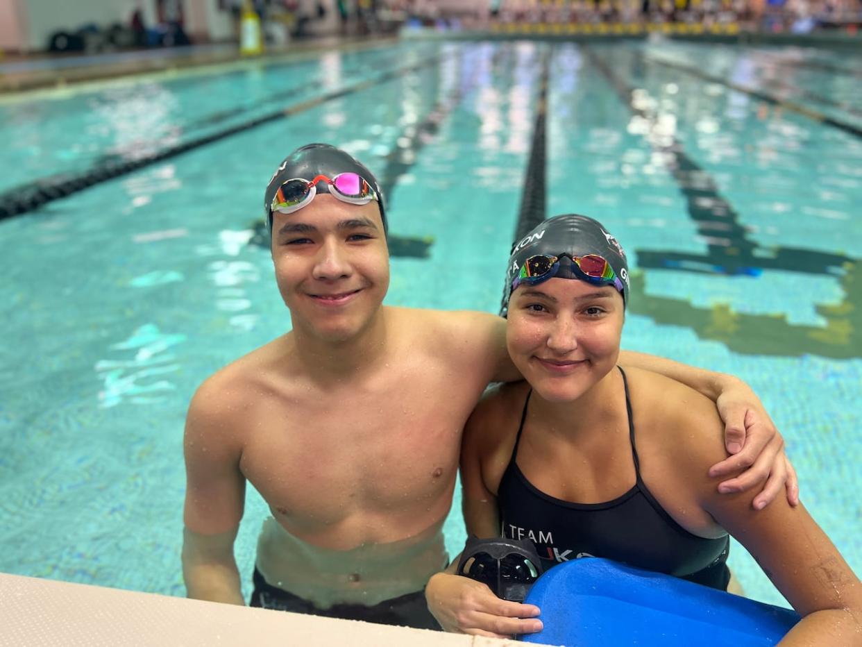 Siblings Tuja Dreyer and Kassua Dreyer, competitive swimmers originally from Ross River, Yukon, at the North American Indigenous Games in 2023 where together thet collected 12 medals, 11 of them gold. (George Maratos/CBC - image credit)