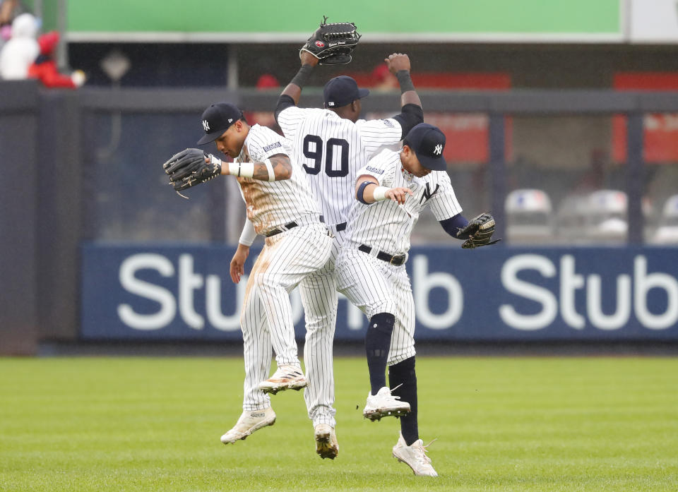New York Yankees Estevan Florial (90), Everson Pereira, left, and Oswaldo Cabrera celebrate after defeating the Arizona Diamondbacks in a baseball game, Monday, Sept. 25, 2023, in New York. (AP Photo/Noah K. Murray)