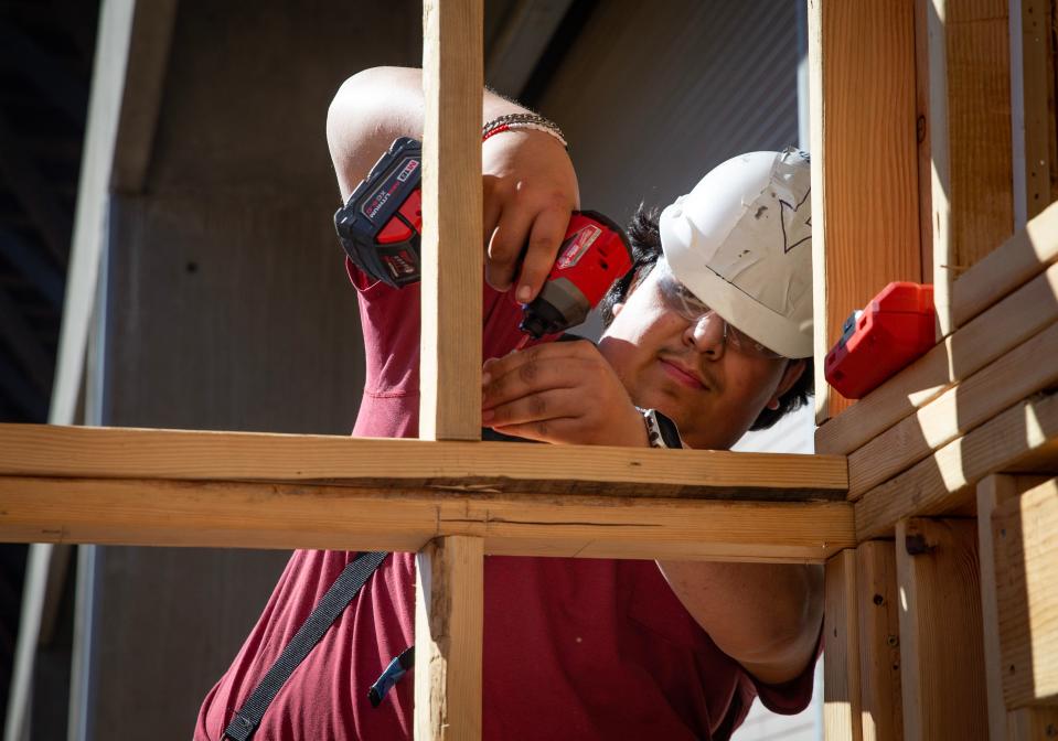 Student Joel Delgadillo works on a structure with Eugene School District 4J’s Constructing a Brighter Future at Lane Community College.